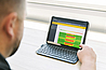 Bender engineer reviewing POWERSCOUT remote monitoring software showing a heatmap for energy usage.
